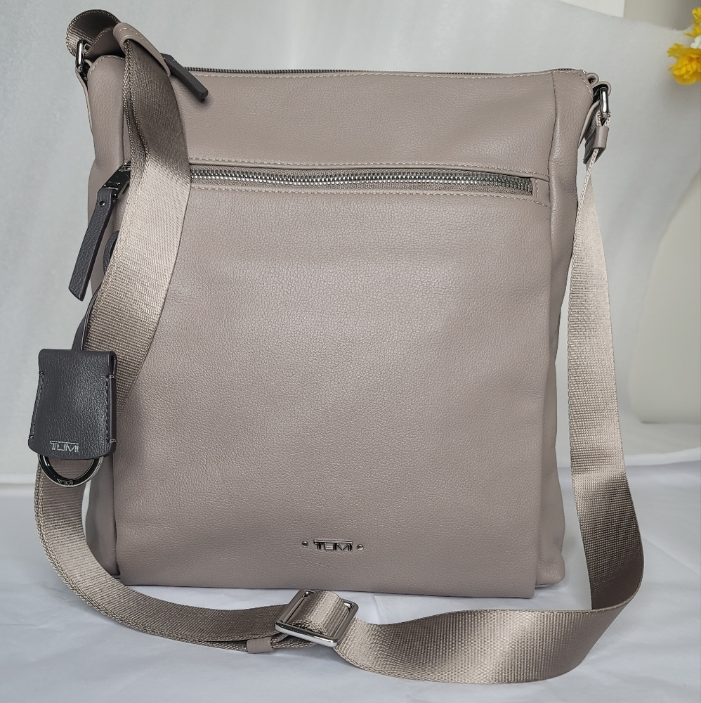 TUMI leather cross body bag.